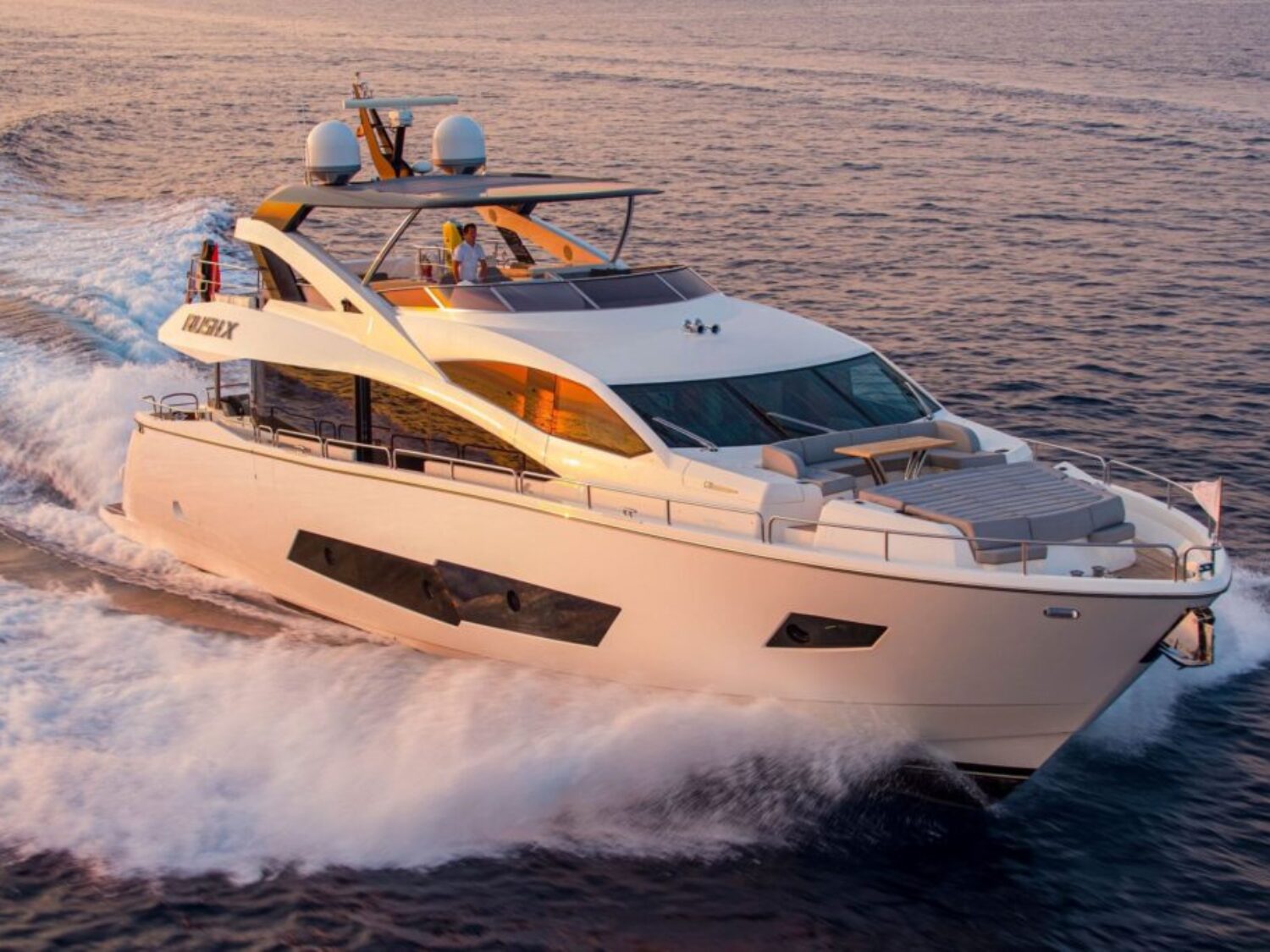 Motor-Yacht-Rush-X-for-charter-in-Mallorca-cruising-with-the-sun-set-1024x683